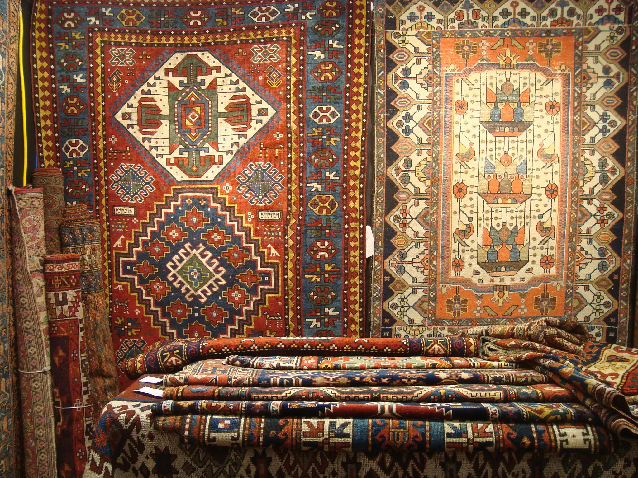 Collection of small antique scatter rugs in various Persian and Caucasian styles