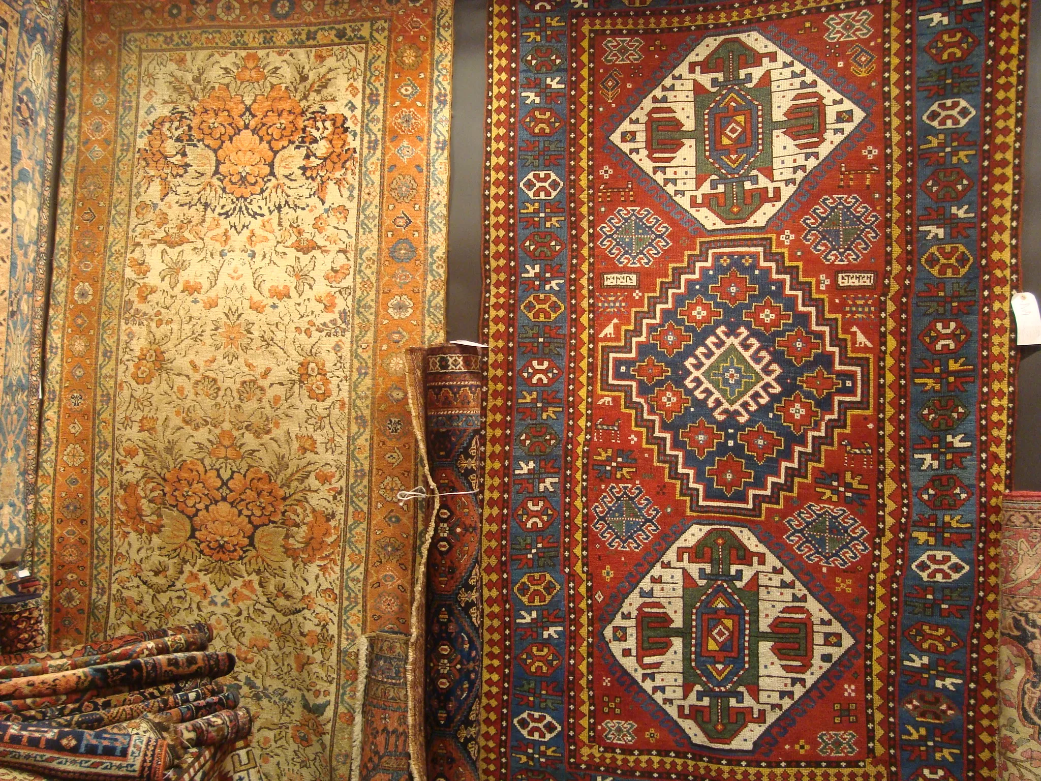 Large room-size antique Persian carpet with ornate floral and vine motifs