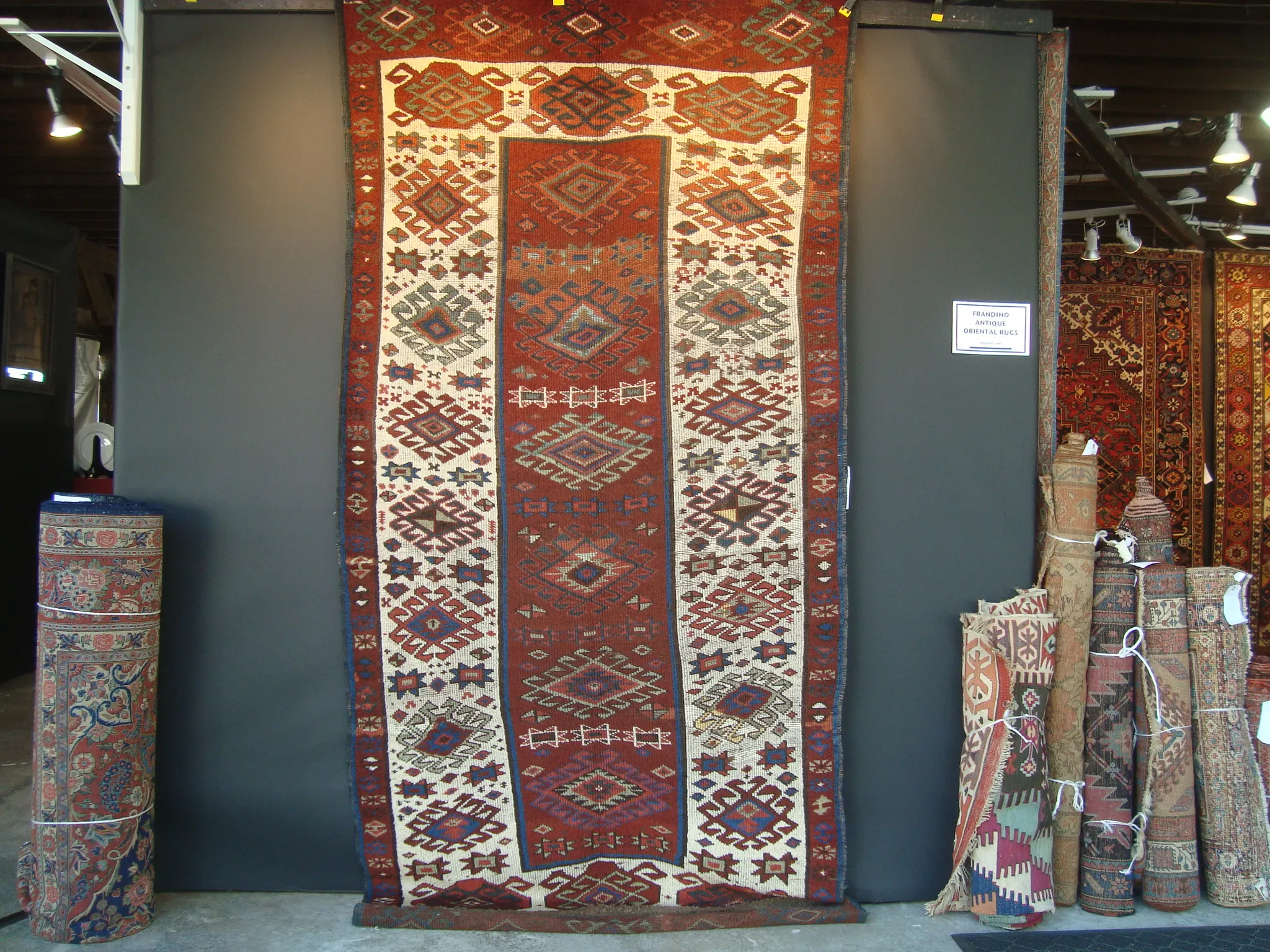 Vintage Turkish prayer rug with mihrab design and calligraphy elements